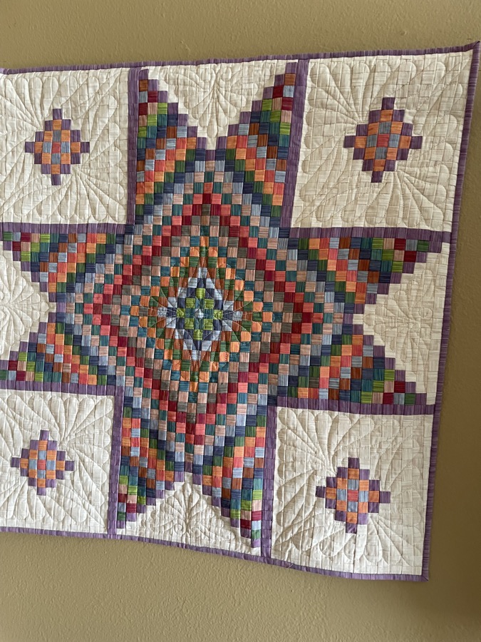 Colorful bargello star quilt multicolor on cream with purple border