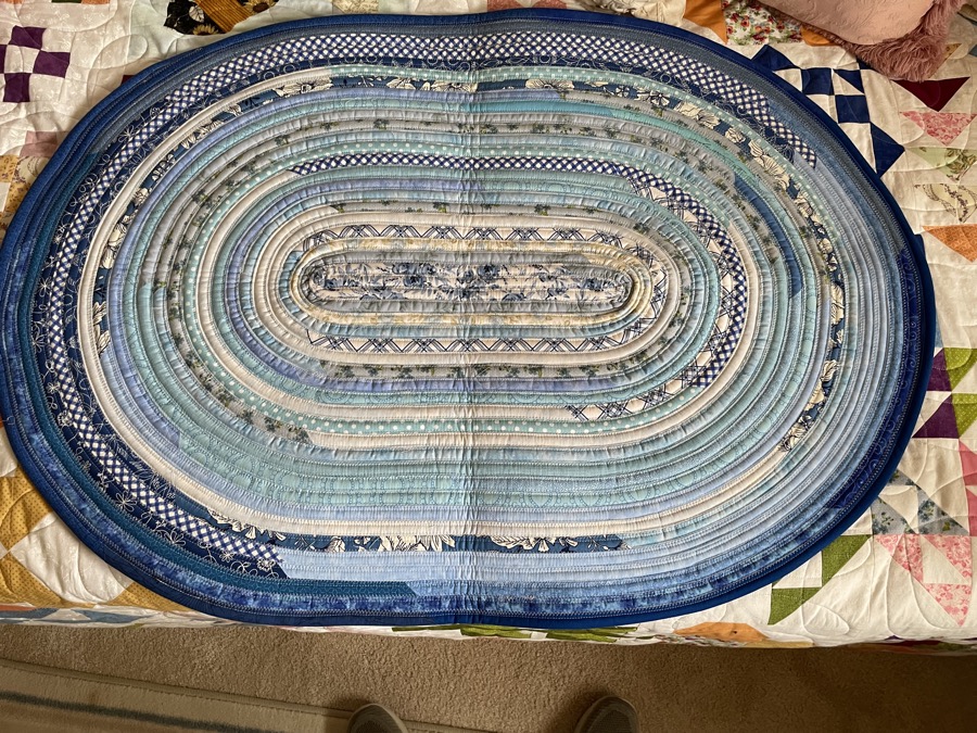Handmade fabric rope rug in blue and cool tones oval shape